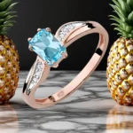 Pierścionek zaręczynowy z różowego złota 585 z błękitnym topazem 0.65ct i diamentami, ręcznie wykonany przez BigDIAMOND Kraków.